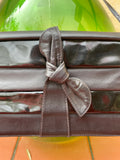 Pochette nera con fiocco